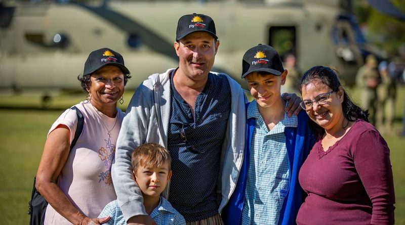 Myron Allen, with his family in front of an Australian Army CH-47 Chinook. Story and photo by Coporal Michael Rogers.