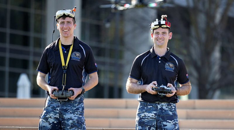 Flight Lieutenant Nicholas Eberl (left) and Flight Lieutenant Jake Dell-O’Sullivan fly their racing drones. Story by Squadron Leader Chloe Stevenson. Photo by Private Nicholas Marqui.