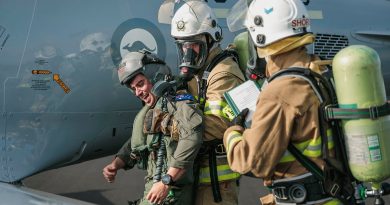 Air Force fire fighters evacuate a simulated casualty from a PC-21 aircraft during a crash exercise at RAAF Base Williamtown, NSW. Story by Wing Commander Sue Yates. Photos by Leading Aircraftman Samuel Miller.