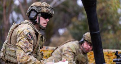 A soldier from the 5th/6th Battalion, Royal Victoria Regiment prepares to record firing orders next to an 81mm mortar at Puckapunyal training area, Victoria. Story by Captains Andrew Lee and Mark Blackman. All photos by Corporal Michael Currie.