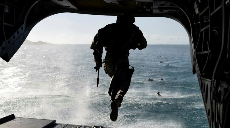 An Australian Army soldier from 2nd Battalion, The Royal Australian Regiment jumps from a Boeing CH-47 Chinook during a helocasting serial as part of Exercise Sea Explorer. Photo by Able Seaman Rikki-Lea Phillips.