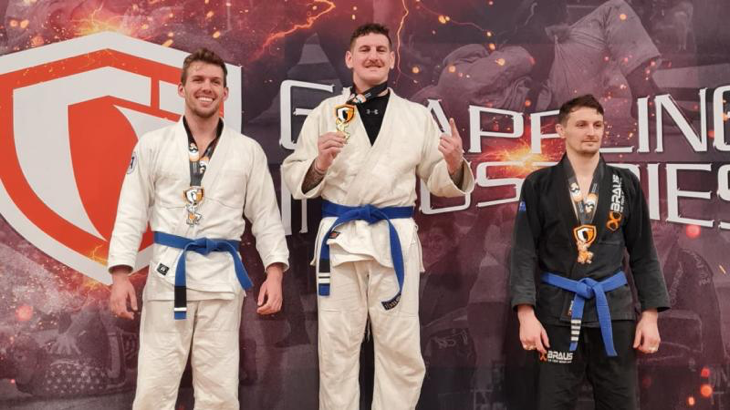 Australian Army officer Captain Dylan Voncina on the podium during the Grappling Industries Brazilian jujitsu gi and nogi round robin tournament in Melbourne. Story by Sergeant Matthew Bickerton.