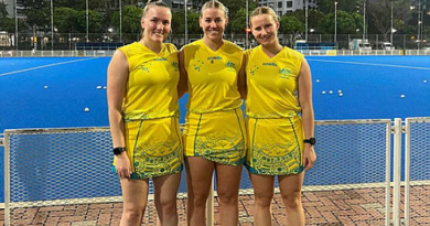 Flying Officer Riley Smith, right, at the Singapore Sports Hub with NSW Country hockey players Clare Bosman and Millie Leard. Story by Corporal Veronica O’Hara. Photo by Flying Officer Riley Smit.