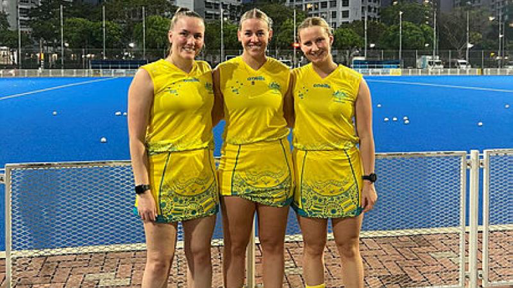 Flying Officer Riley Smith, right, at the Singapore Sports Hub with NSW Country hockey players Clare Bosman and Millie Leard. Story by Corporal Veronica O’Hara. Photo by Flying Officer Riley Smit.