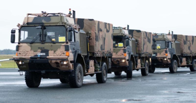 Three autonomous Army trucks ready for the leader-follower trial.