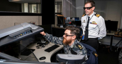 Leading Seaman M demonstrates the precise point mensuration process to Head of Navy Capability Rear Admiral Stephen Hughes at Air Force’s 460 Squadron.