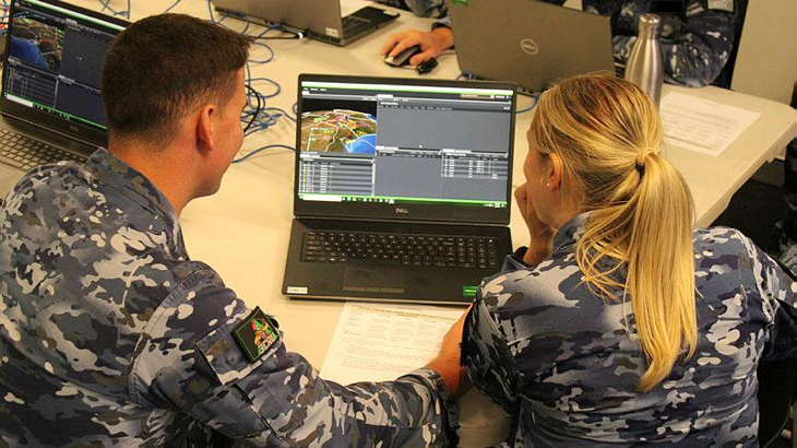 Flying Officers Nicholas Martin and Sarah Wickham use the I-Sim laptop simulation system during an Integrated Air and Missile Defence course – delivered by the US’ Joint Ballistic Missile Defense Education and Training Center. Story by Flight Lieutenant Claire Burnet. Photo by Squadron Leader Carlos Molina.