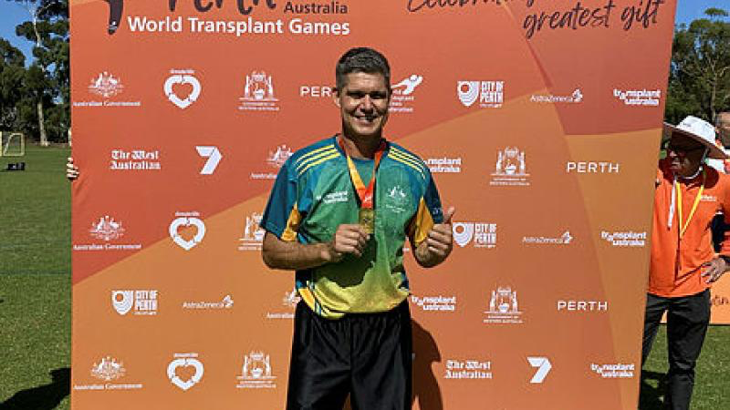 Squadron Leader Mark Oksanen wearing the gold medal he won in soccer at the 2023 World Transplant Games. Story by Leading Aircraftwoman Jasna McFeeters.