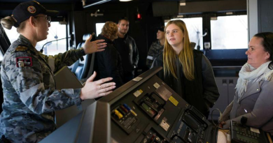 An HMAS Sydney crew member teaches visitors about the ship during an open day. Story by Lieutenant Samantha Robson. All photos by Tyson Burraston.