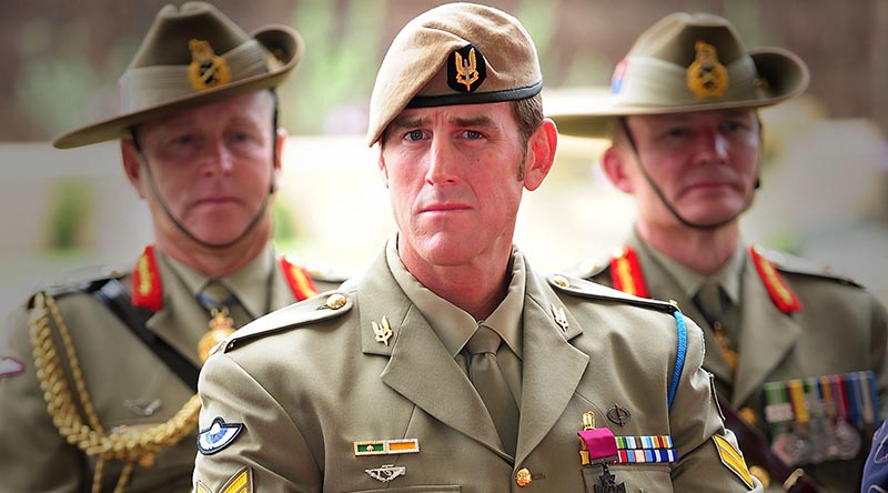 Australian Army soldier Corporal Benjamin Roberts-Smith, VC, MG, takes a seat after being awarded the Victoria Cross for Australia during the investiture ceremony in Perth on 23 January 2011. Photo by Corporal Chris Moore.