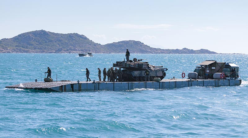 An Australian Army M1A1 Abrams tank is transferred to shore via HMAS Choules' Mexeflote during Exercise Sea Raider 2023. Photo by Sergeant Andrew Sleeman.