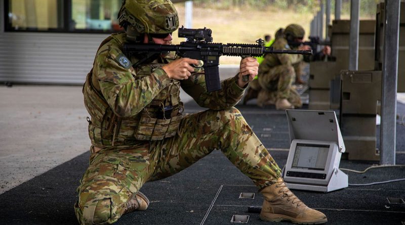 A soldier from 9th Force Support Battalion fires an M4 during a live-fire exercise at the Greenbank Training Area, Queensland. Story by Captain Thomas Kaye. All photos by Captain Annie Richardson.