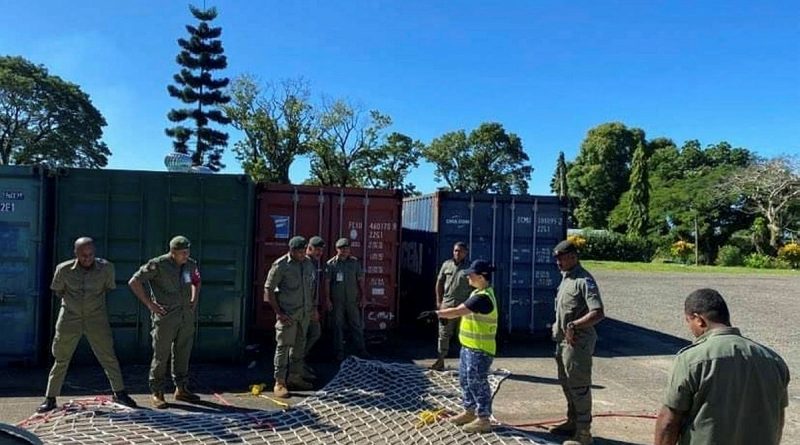 Royal Australian Air Force Sergeant Roxanne Phillip giving a practical lesson on the 10,000lb cargo net at Queen Elizabeth Barracks in Suva, Fiji. Story by Flight Lieutenant Steffi Blavius. Photo by Flight Sergeant Anne Strode.