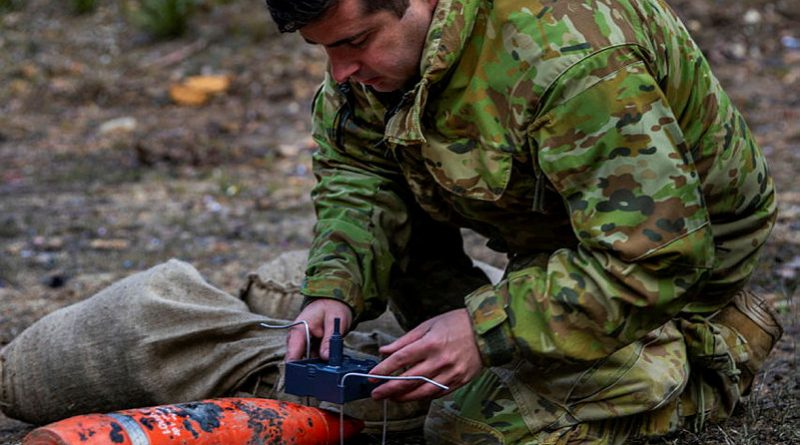 Army Corporal Nathan Jones, part of the Joint Explosives Ordnance Support explosive ordnance disposal team, places a charge during Exercise Nepean Harvest 23 at Marrangaroo Military Training Area. Story by Captain Thomas Kaye. Photo by Sergeant Brodie Cross.