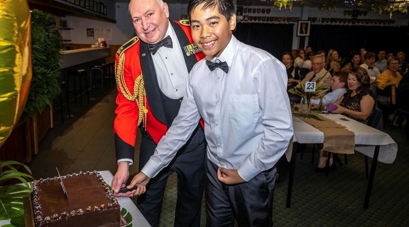 Major General Douglas Laidlaw cuts the cake with Cadet Zhyler Cawit during the 230 Army Cadet Unit 25th anniversary celebration. Story by Stacey Doyle. Photo by Shane Brandon.