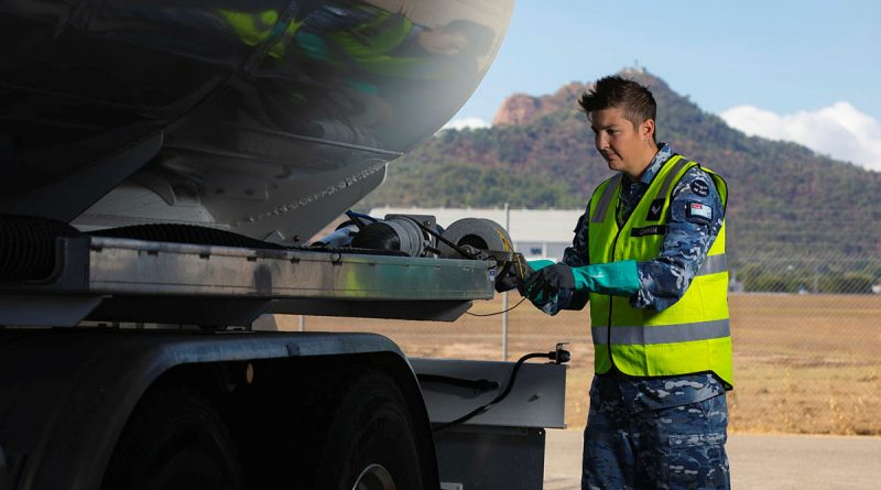 Corporal Hannah Graham winds in the earthing cable before heading out to refuel. Story b y Flying Officer Sharon Sebastian. Photo by Leading Aircraftman Ryan Howell.