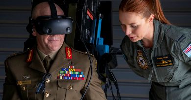 Pilot Officer Georgia Wales leads Head of People Capability, Major General Wade Stothart through the Air Force virtual reality flight simulator during the Defence and Questacon partnership announcement. Story by Corporal Luke Bellman. All photos by Leading Aircraftwoman Annika Smit.