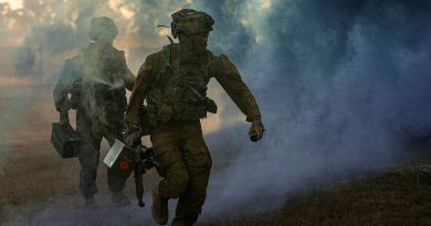 Australian Army riflemen from Battle Group Heeler deliver ammunition in a simulated urban assault during Exercise Southern Jackaroo, Townsville Field Training Area. Story by Major Roger Brennan. All photos by Corporal Nicole Dorrett.