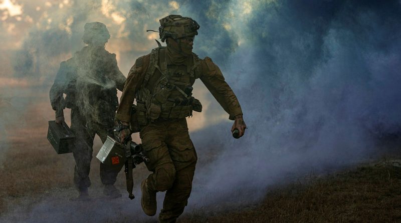 Australian Army riflemen from Battle Group Heeler deliver ammunition in a simulated urban assault during Exercise Southern Jackaroo, Townsville Field Training Area. Story by Major Roger Brennan. All photos by Corporal Nicole Dorrett.