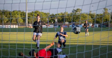Petty Officer Jessica Gunning scores a goal during a 4th of July soccer match between the Royal Australian Navy and the United States Marine Corps held at Darwin Football Stadium, Northern Territory. Story by Lieutenant Jessica Blackman. Photo by Leading Seaman Leo Baumgartner.