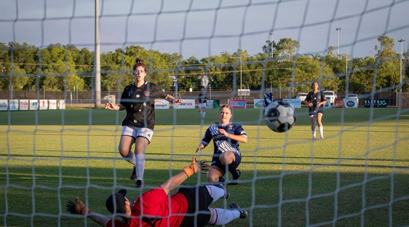 Petty Officer Jessica Gunning scores a goal during a 4th of July soccer match between the Royal Australian Navy and the United States Marine Corps held at Darwin Football Stadium, Northern Territory. Story by Lieutenant Jessica Blackman. Photo by Leading Seaman Leo Baumgartner.