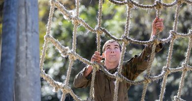 An Australian Army cadet climbs the cargo net during the Chief of Army Cadet Team Challenge 2023 at Kokoda Barracks in Canungra, South Queensland. Story by Stacey Doyle. Photo by Leading Seaman Nadav Harel.