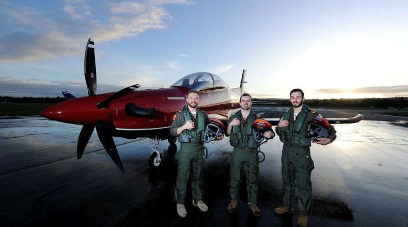 270 ADF Pilots' Course graduates (from left) Lieutenant Michael Harrigan, Lieutenant Gregory Cook and Lieutenant Harrison Coldwell pose for a photo at dawn on the flight line with a Pilatus PC-21 aircraft at RAAF Base Pearce in WA. Story by Stephanie Hallen. Photos by Chris Kershaw.