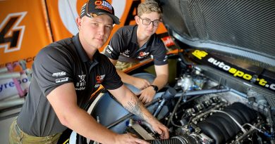 Australian Army vehicle technicians Craftsmen Thomas Noble and Layla Williamson from 5th Aviation Regiment check the engine of a Matt Stone Racing Chevrolet Camaro Supercar at the 2023 NTI Townsville 500, Queensland. Story and photo by Flight Lieutenant Nick O'Connor.