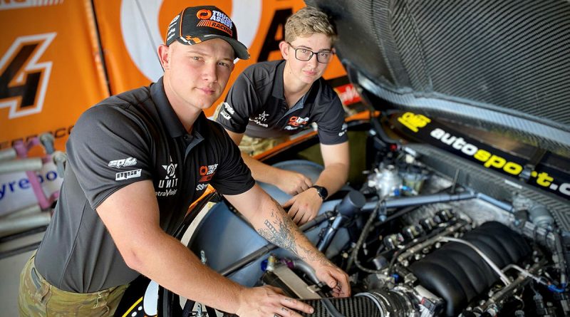 Australian Army vehicle technicians Craftsmen Thomas Noble and Layla Williamson from 5th Aviation Regiment check the engine of a Matt Stone Racing Chevrolet Camaro Supercar at the 2023 NTI Townsville 500, Queensland. Story and photo by Flight Lieutenant Nick O'Connor.