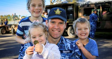 The Gibbins family, including, Tommy, 8, Johnny, 5, Betty, 3, and dad Stephen enjoy the activities on display at the Defence member and family support Child of the Medallion event at RAAF Base Williamtown, NSW. Story by Corporal Melina Young. Photo by Sergeant Craig Barrett.