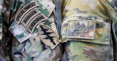 An Australian Army special forces soldier from 2nd Commando Regiment and a United States Army soldier from 1st Special Forces Group (Airborne) prepare for a static-line parachuting training jump side-by-side at RAAF Base Richmond in Sydney. Photos by Corporal Cameron Pegg.