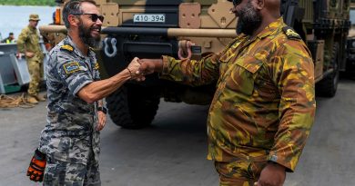 Commanding Officer HMPNGS Cape Gloucester Lieutenant Bryan Pohai, left, reunites with old friend, ADV Reliant Naval Liaison Officer Lieutenant Commander Brenton-James Glover, alongside at Manus Island. Story. by Lieutenant Carolyn Martin. Photo by Corporal Lisa Sherman.