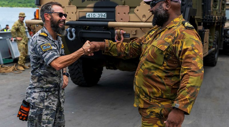 Commanding Officer HMPNGS Cape Gloucester Lieutenant Bryan Pohai, left, reunites with old friend, ADV Reliant Naval Liaison Officer Lieutenant Commander Brenton-James Glover, alongside at Manus Island. Story. by Lieutenant Carolyn Martin. Photo by Corporal Lisa Sherman.