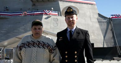 Lieutenant Ryan Tyrrell, right, and his stepfather Marty Wollins in front of USS Canberra during its commissioning at Fleet Base East, Sydney. Story by Sub-Lieutenant Tahlia Merigan. Photo by Petty Officer Helen Frank.