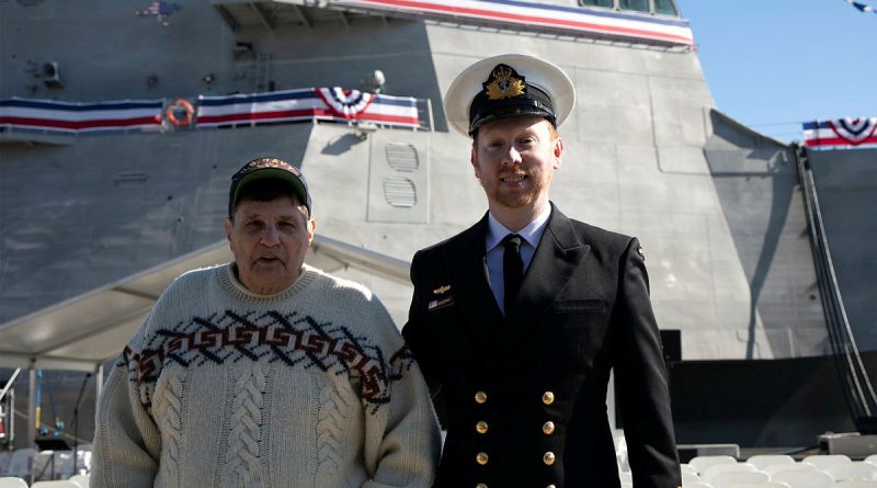 Lieutenant Ryan Tyrrell, right, and his stepfather Marty Wollins in front of USS Canberra during its commissioning at Fleet Base East, Sydney. Story by Sub-Lieutenant Tahlia Merigan. Photo by Petty Officer Helen Frank.