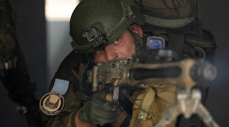 A German Army Paratrooper provides support by fire during a clearance of Line Creek Junction on Exercise Talisman Sabre 2023 at Townsville Field Training Area, Queensland. Story by Captain Joanne Leca. Photos by Lance Corporal Riley Blennerhassett.