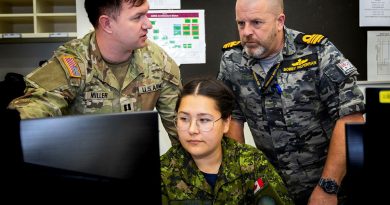 (L-R) United States Army Captain Edward Miller, Royal Canadian Air Force Corporal Julie Vallee and Royal Australian Navy Lieutenant Commander Bobby McFerran work at the Coalition Data Network Centre (CDNC) located within the Battle Simulation Centre in Gallipoli Barracks, Brisbane, in support of Exercise Talisman Sabre 2023. Story by Captain Nic Rutledge. Photo by Madhur Chitnis.