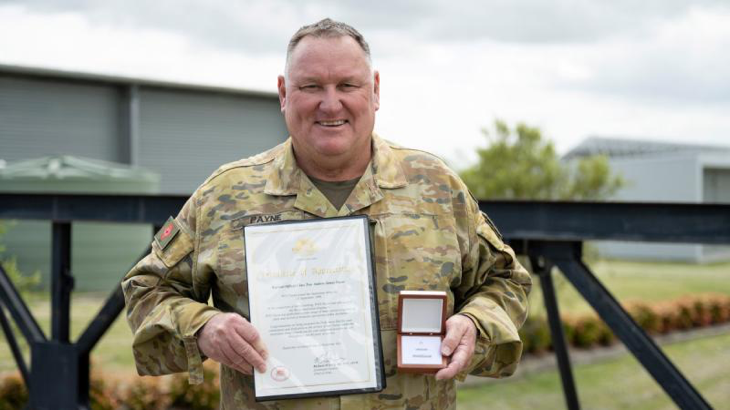 Warrant Officer Class Two Andrew Payne, of 6th Engineer Support Regiment, with the Federation Star clasp to his Defence Force Long Service Medal and a Certificate of Appreciation in recognition of 40 years of service to the ADF. Story by Captain Evita Ryan. Photo by Warrant Officer Class 2 Kim Allen.