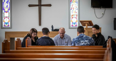Samuel Hays (centre) leads the National Day of Prayer for Defence at Saint John's protestant chapel at RAAF Base Williamtown. Story and photo by Corporal Melina Young.