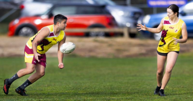 Corporal Jacob Cutmore passes the ball to Captain Charlotte Hargreaves during a game at the 2023 ACT NAIDOC Touch Football carnival on July 15. Story by Private Nicholas Marquis.