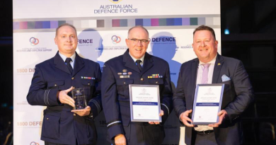 Squadron Leader Nathan Hook, left, with Acting Head Joint Support Services Division Air Commodore Grant Pinder, and civilian employer Peter Nugent from AeroPM. Story by Emily Egan. Photo by Hilary Wardhaugh.