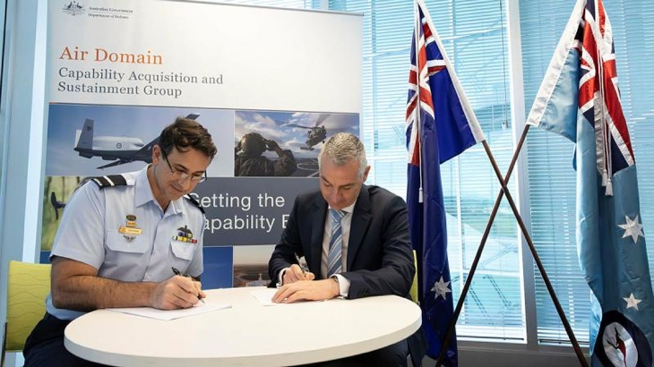 Air Commodore Steve Pesce and Steve Green sign a three-year contract to provide services as Air Domain's Aerospace Propulsion Centre of Expertise. Story by Group Captain David Mahoney. Photo by Private Nicholas Marquis.