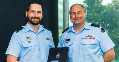 RAAF Flight Lieutenant Sean Wrigley receives a Chief of Air Force Gold Medal Commendation from Director of Aviation Operations Group Captain Chris Pouncey at Fairbairn, ACT. Story by Squadron Leader Barrie Bardoe. Photo by Leading Aircraftman Ryan Howell.