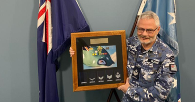 Flight Sergeant Stephen Olding with his presentation gift to mark his retirement from the RAAF. Story by Wing Commander Susan Yates.