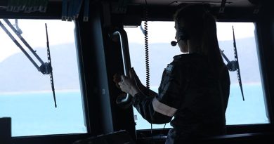 A Royal Australian Navy sailor on the bridge of HMAS Brisbane keeps watch during search operations for the crashed MRH-90 in the vicinity of Lindeman Island during Exercise Talisman Sabre 23. Photo by Leading Seaman Hannah Linsley.