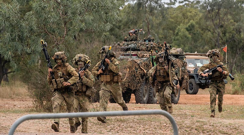 NZ Light Armoured Vehicles and infantry clearing a route during Exercise Talisman Sabre. Photo supplied.