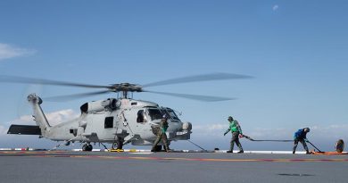 Flight deck crew on HMAS Adelaide 'hot refuel' a running MH-60R Seahawk helicopter during Exercise Ocean Explorer 2017, off the west coast of Australia. Photo by Leading Seaman Peter Thompson.
