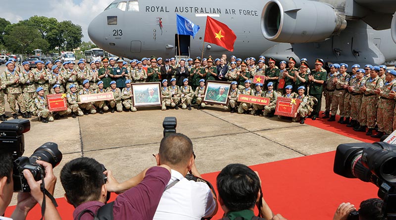 Vietnam’s President Võ Văn Thưởng with peacekeepers from the Vietnam People's Army Level Two Field Hospital contingent - Rotation Five, alongside a Royal Australian Air Force C-17A Globemaster during a farewell ceremony from Ho Chi Minh City, Vietnam, to South Sudan. Photo by Corporal Dan Pinhorn.