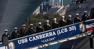 Crewmembers of the United States Navy's USS Canberra bring the ship to life during the ship’s commissioning ceremony in Sydney, Australia. US Navy photo by Mass Communication Specialist 1st Class Mark D. Faram.