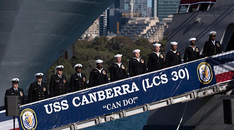 Crewmembers of the United States Navy's USS Canberra bring the ship to life during the ship’s commissioning ceremony in Sydney, Australia. US Navy photo by Mass Communication Specialist 1st Class Mark D. Faram.